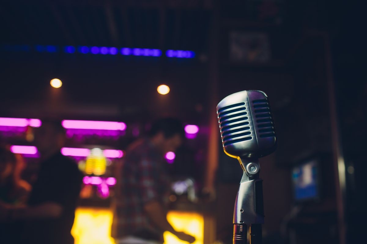 Retro microphone on stage in a pub or American Bar restaurant during a night show.